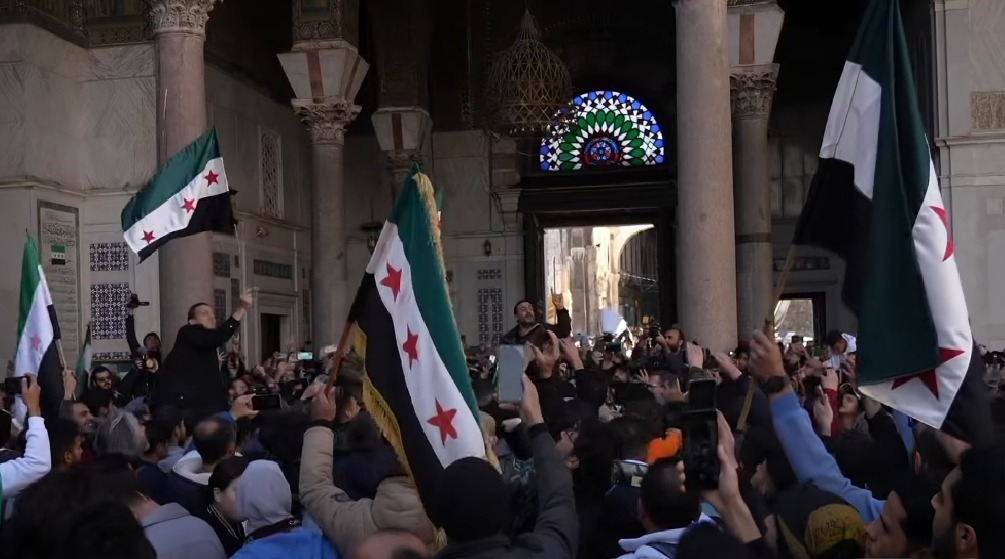 Syrians celebrate the fall of Assad at the Umayyad mosque, 14 December 2024